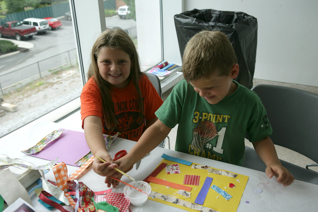 Parents and children creating art as a family.