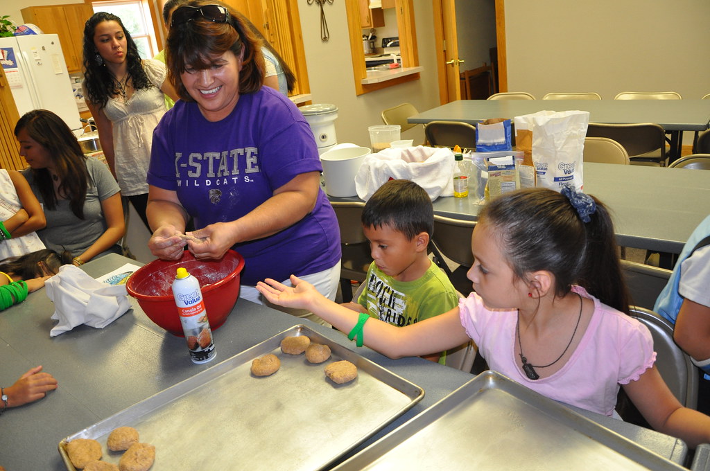 Family kitchen time with parents and children.