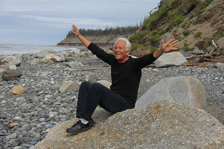 Happy old man in the beach