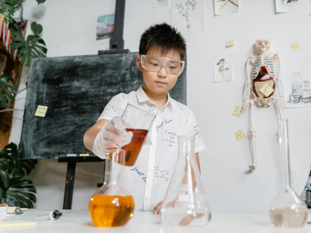 Youngster engaged in a science experiment with family members